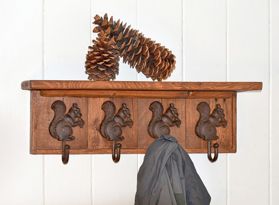 antique finish wall mount coat rack with shelf and four cast iron squirrel coat hooks
